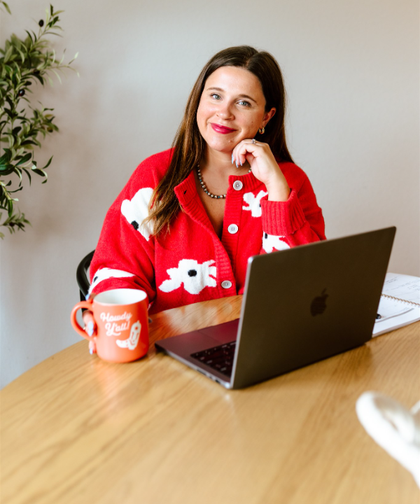 Calley, founder of Sway Email Studio, at her desk